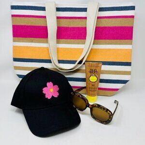 Sunbum SPF 50 Sunscreen, Beach Tote, flowered baseball cap, tortoise sunglasses